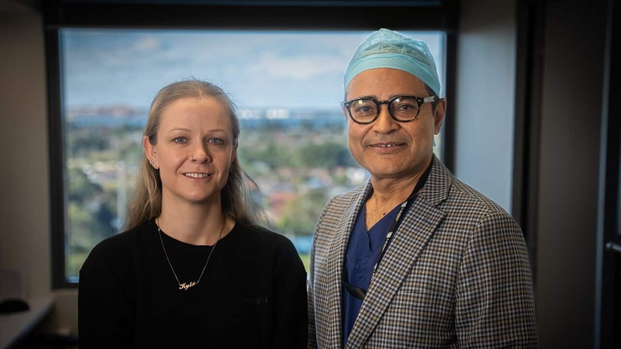 Backpain sufferer Kylie Stewart (left) with spine surgeon Dr Ashish Diwan (SBS-Sandra Fulloon).jpg