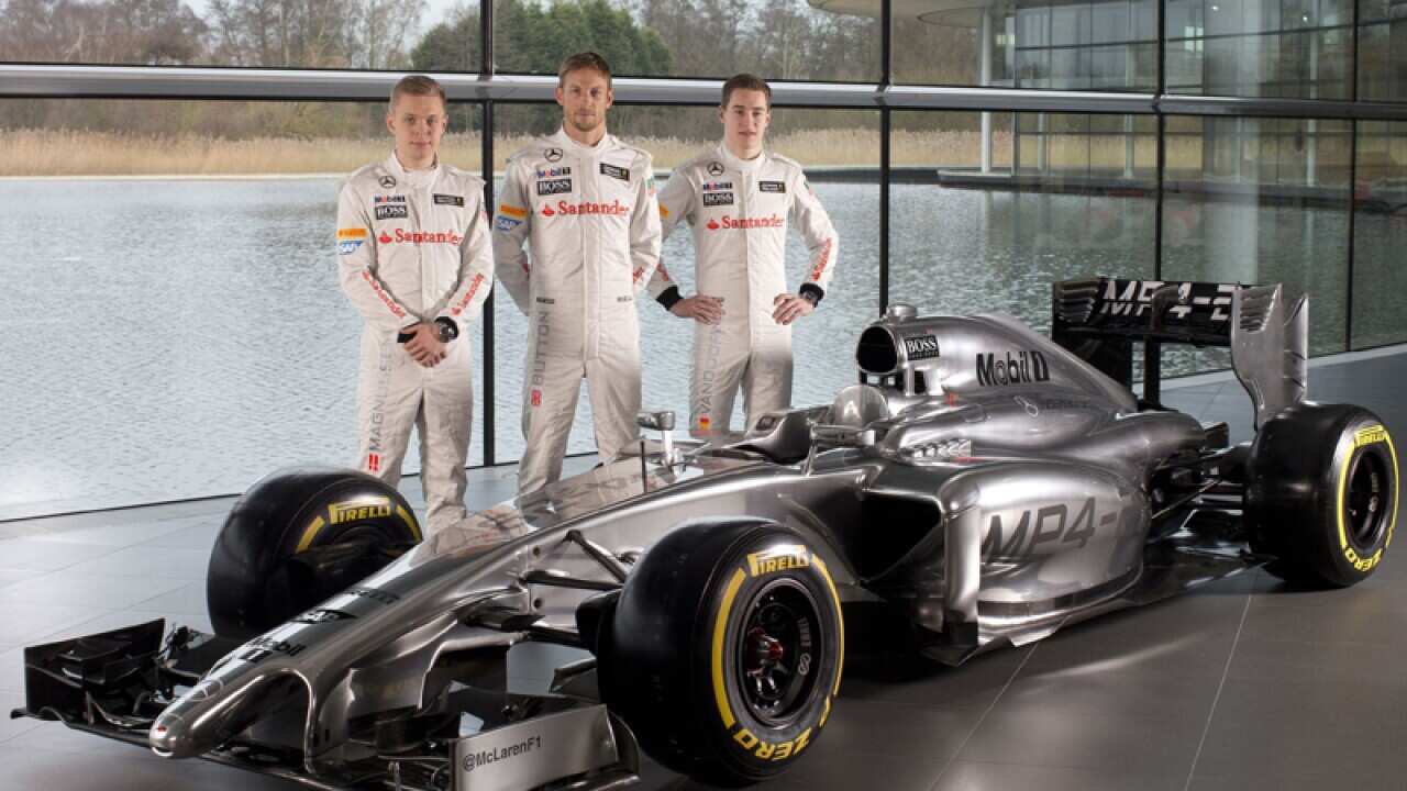 British McLaren Formula One driver Jenson Button (C)