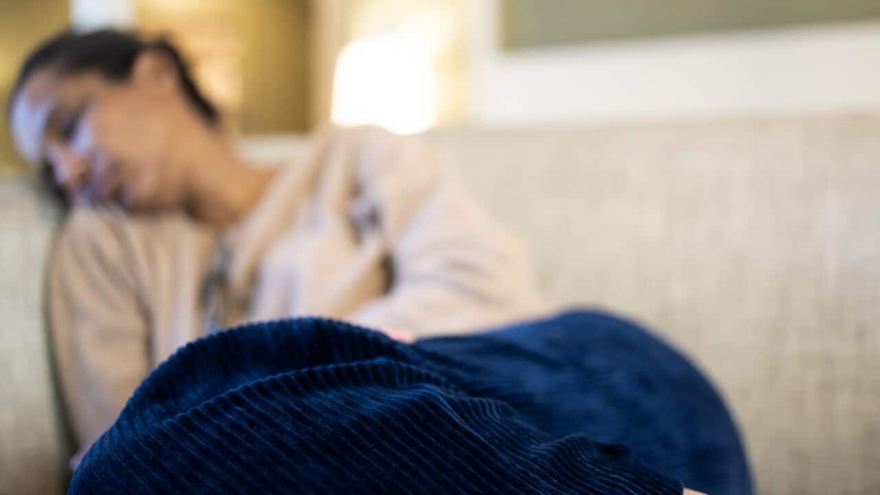 black woman napping on sofa