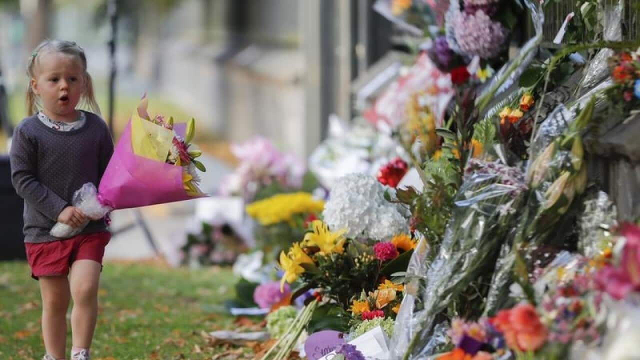 Floral tributes outside one of the mosques. The gunman allegedly killed 51 worshipers during his attack.