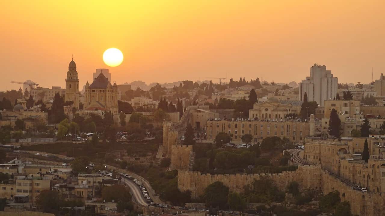 This photo taken on Oct. 29, 2022 shows a sunset view seen over the Mount of Olives in Jerusalem. (Photo by Wang Zhuolun/Xinhua via Getty Images)