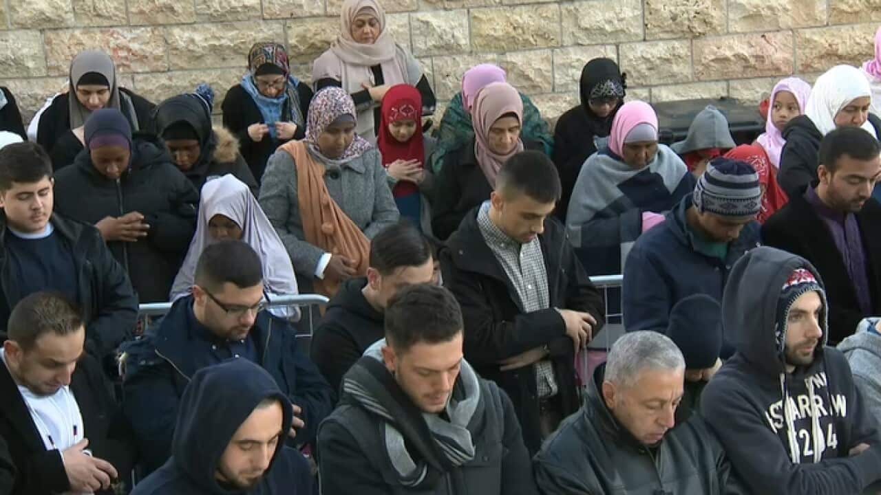 Muslims gather at Lakemba mosque in Sydney to mark Eid al-Fitr