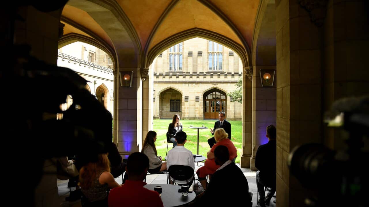 Students under an arch listening to the US Secretary of State at Melbourne Uni (AAP)