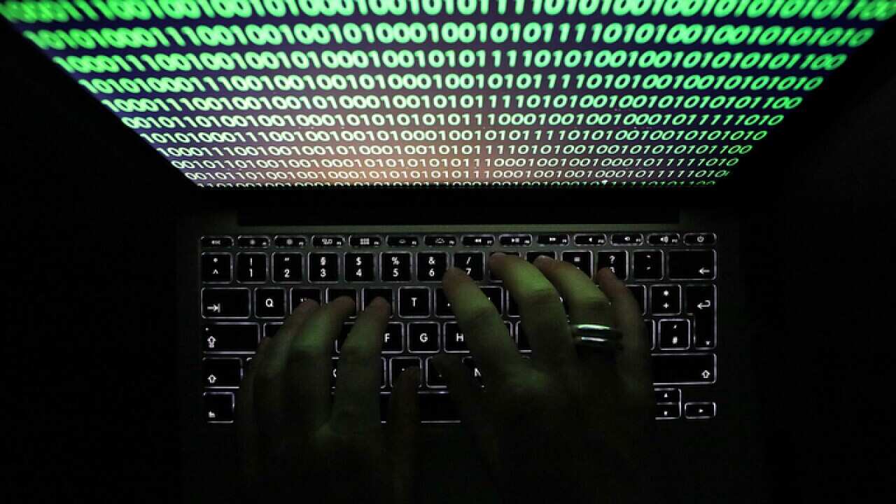 A computer monitor displaying binary code (AAP)