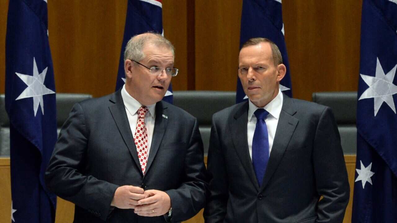File image of then Australian Federal Social Services Minister Scott Morrison (left) and then Australian Prime Minister Tony Abbott, right.