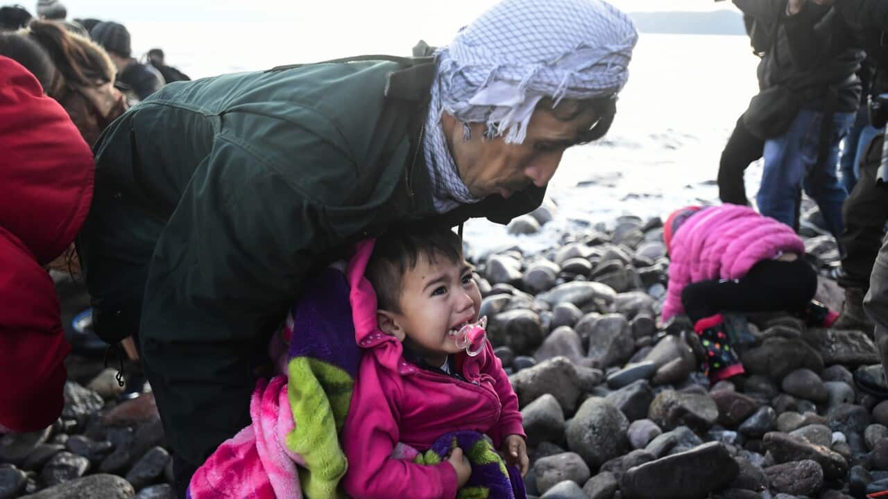 A child cries as migrants arrive at the village of Skala Sikaminias, on the Greek island of Lesbos, after crossing on a dinghy the Aegean sea from Turkey.