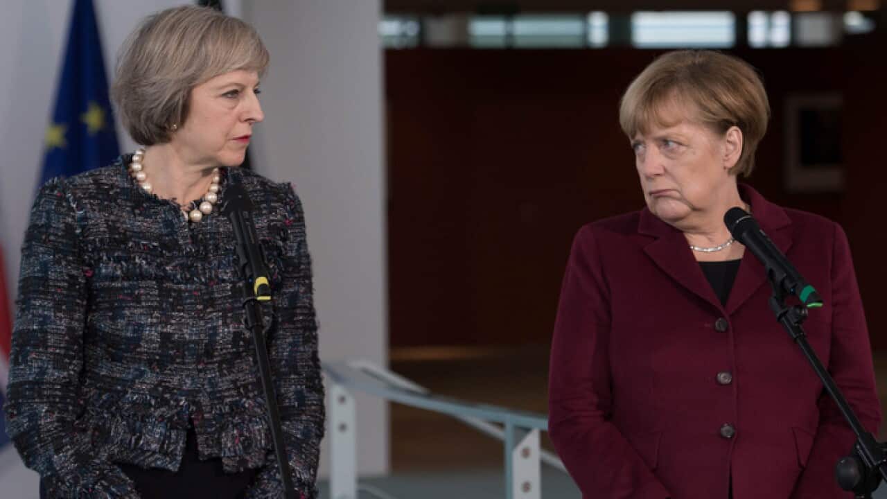 File photo dated 18/11/16 of Theresa May (left) and Angela Merkel,