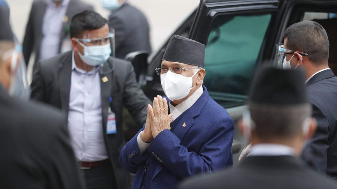 Nepal Prime Minister Khadga Prasad Oli, center, arrives at the parliament in Kathmandu, Nepal, Monday, May 10, 2021. Oli asked parliament for a vote of confidence on Monday in an attempt to show he still has enough support to stay in power despite an expe