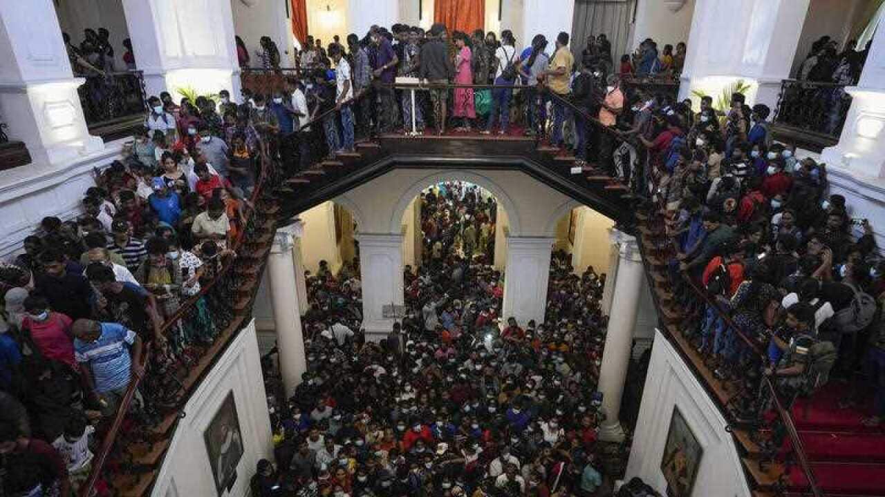People throng President Gotabaya Rajapaksa’s official residence for the second day after it was stormed in Colombo, Sri Lanka