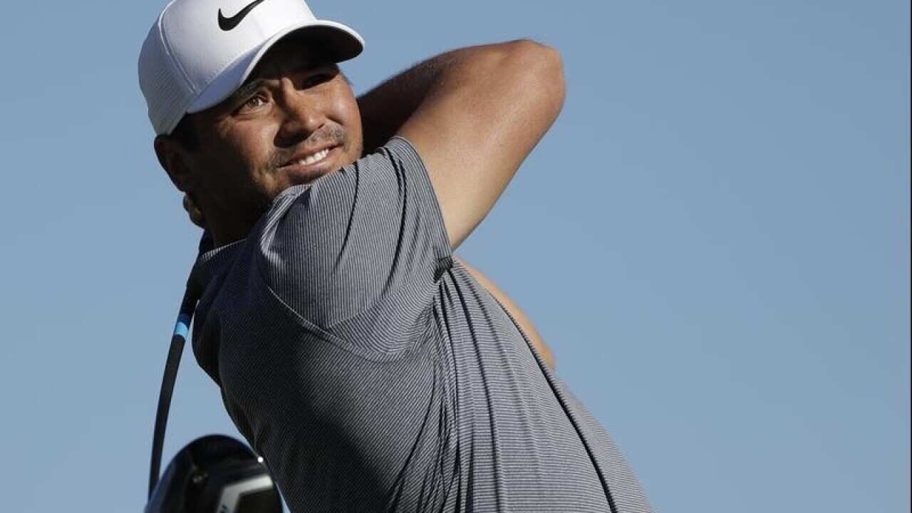 Jason Day, of Australia, watches his tee shot