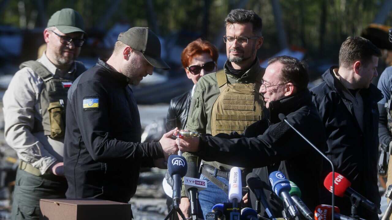 Polish Minister of Interior and Administration Mariusz Kaminski (R) and Ukrainian Interior Minister Denys Monastyrsky (L) are seen during a visit at the Hostomel Airfield, after the battles with Russian troops