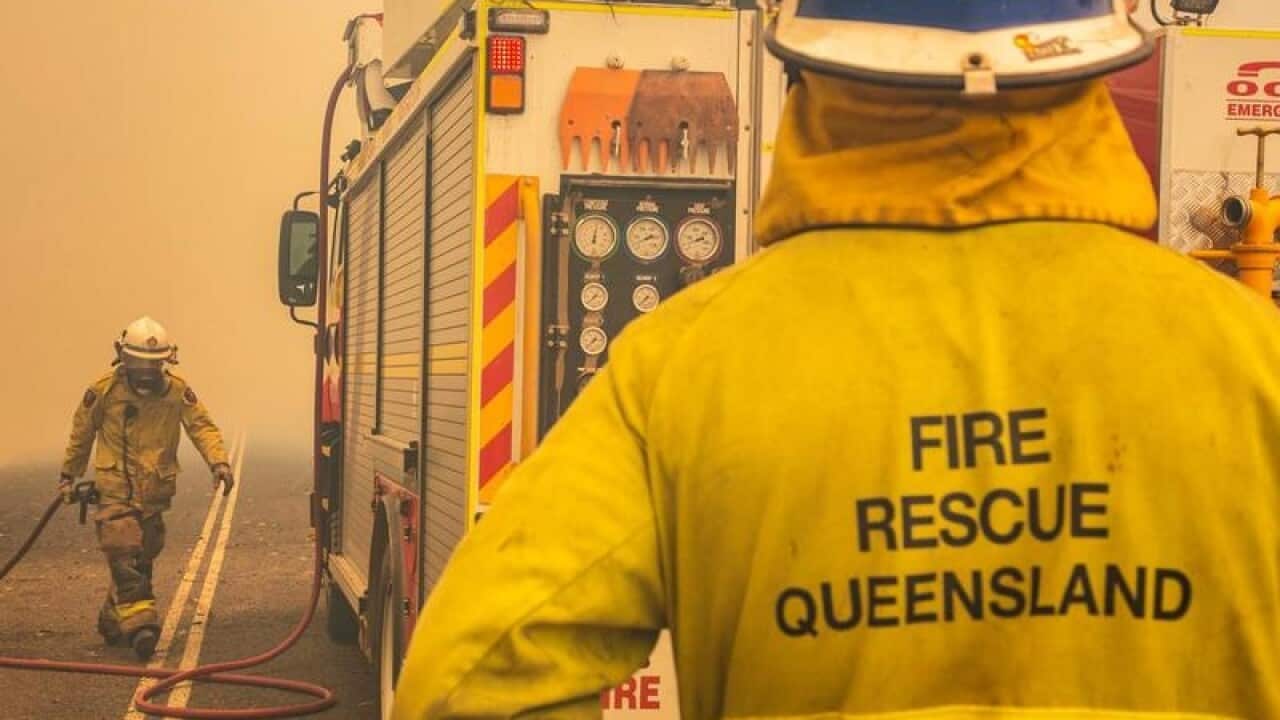 firefighters working to control a bushfire in Central Queensland