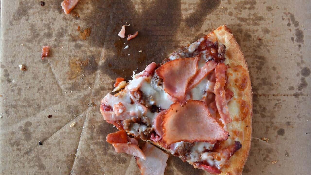 A single slice of a meatlovers pizza