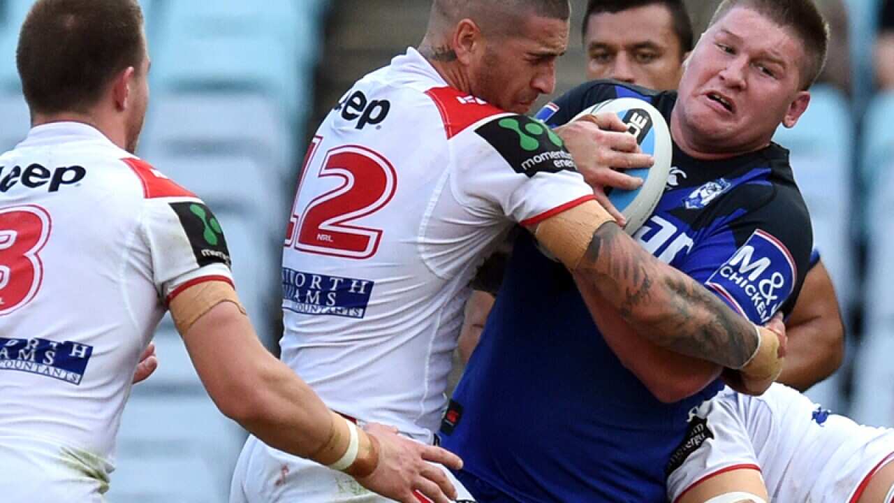 Bulldogs player Greg Eastwood is tackled