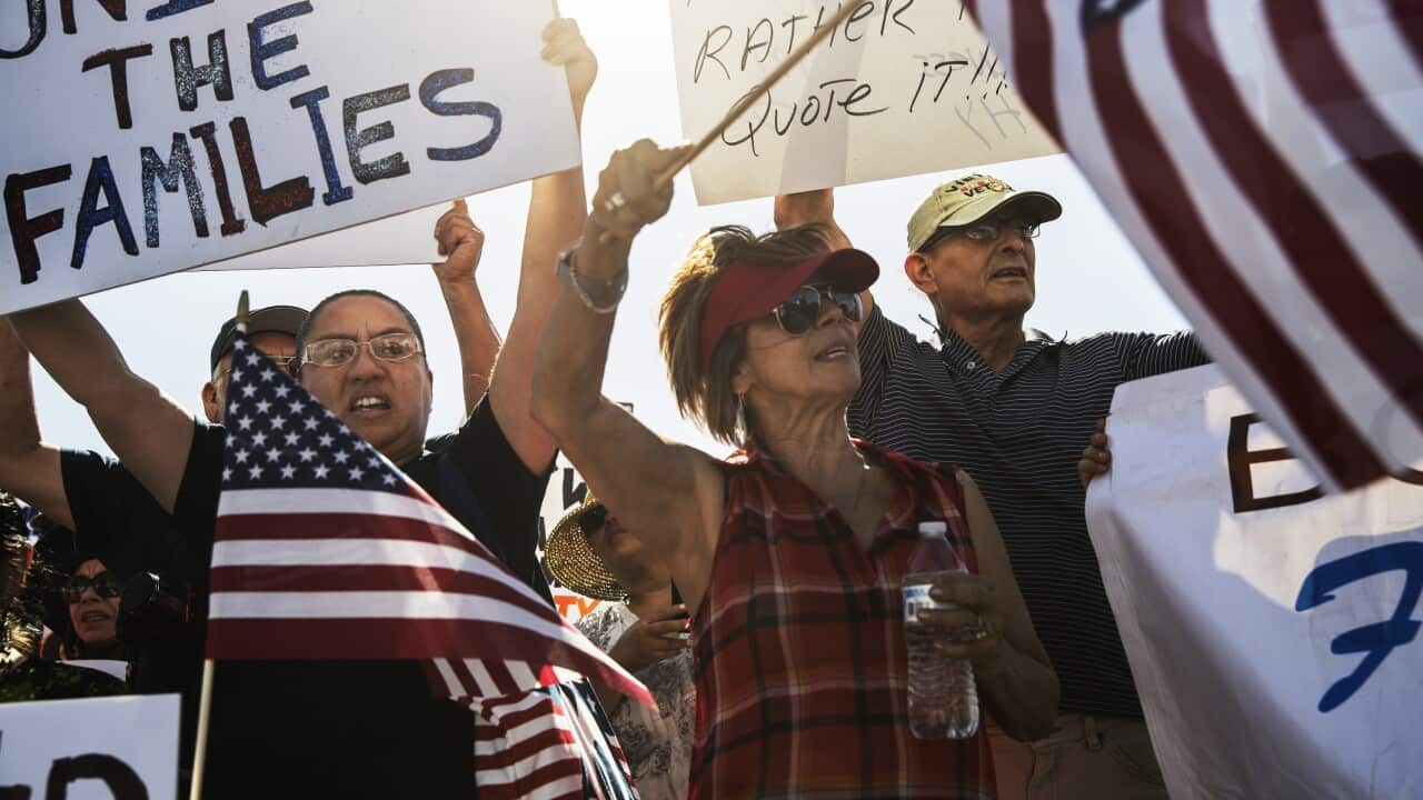 Demonstrators protest near the site of a tent city for migrant children near Tornillo, Texas,