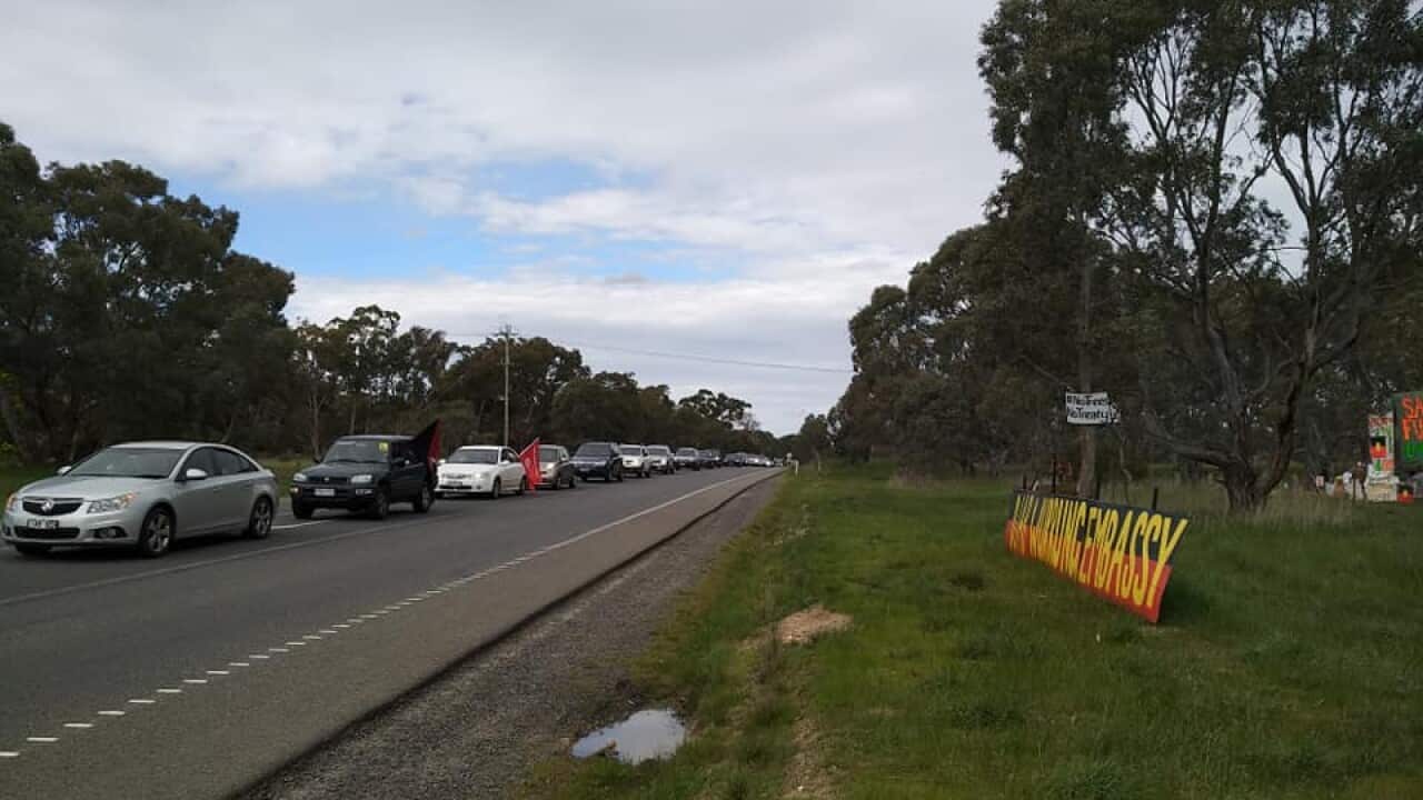 The Victorian Trades Hall Council convoy arriving at the Embassy site.