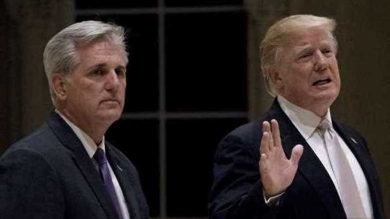 President Donald Trump, accompanied by House Majority Leader Kevin McCarthy of Calif