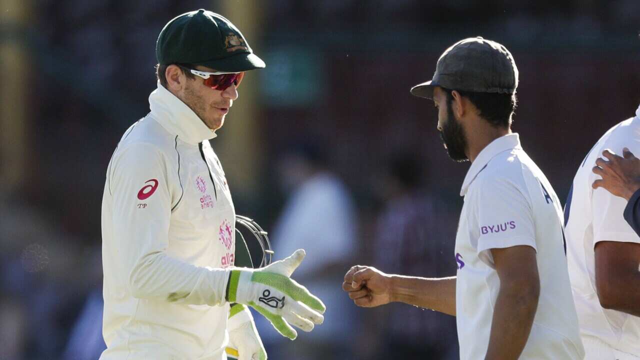 Australia’s Tim Paine and India's Ajinkya Rahane on the final day of cricket