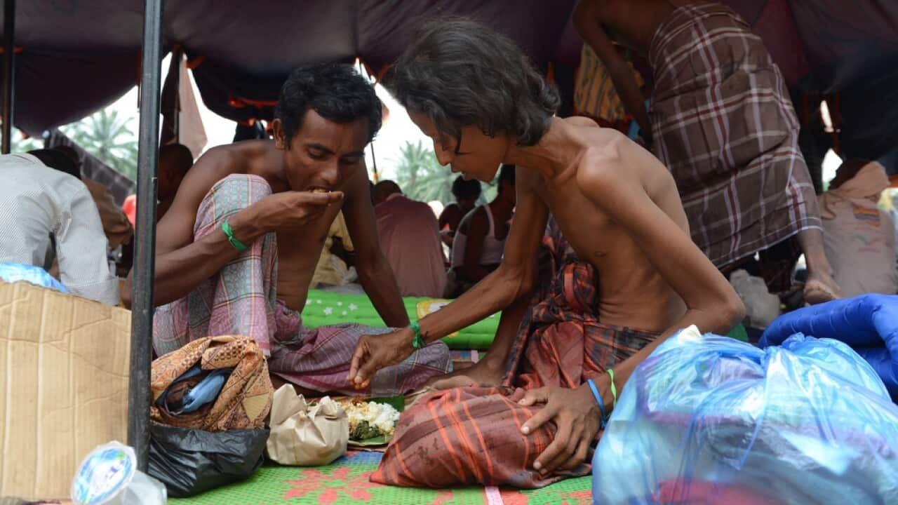Rohingya men at a confinement area for migrants at Bayeun, Aceh province, Indonesia