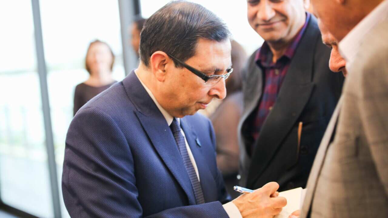 Rehan Alavi signing his book