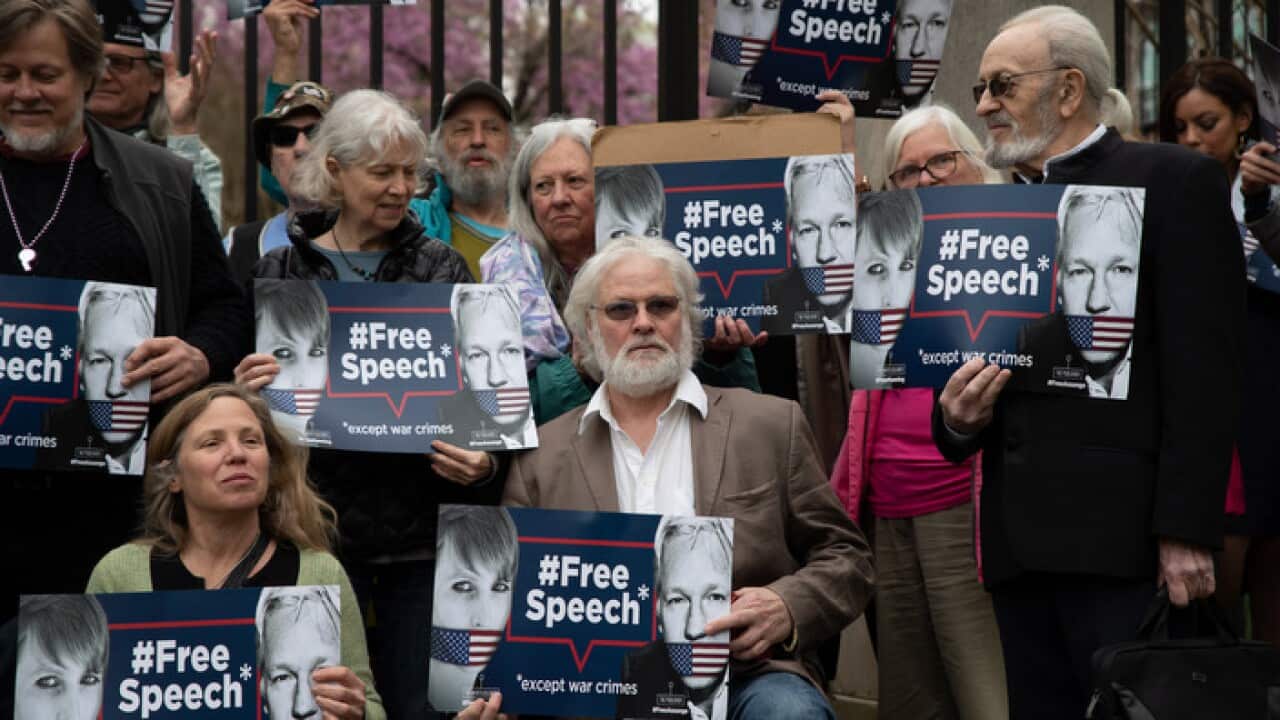 Supporters of Wikileaks founder Julian Assange protest outside the British Embassy in Washington, DC
