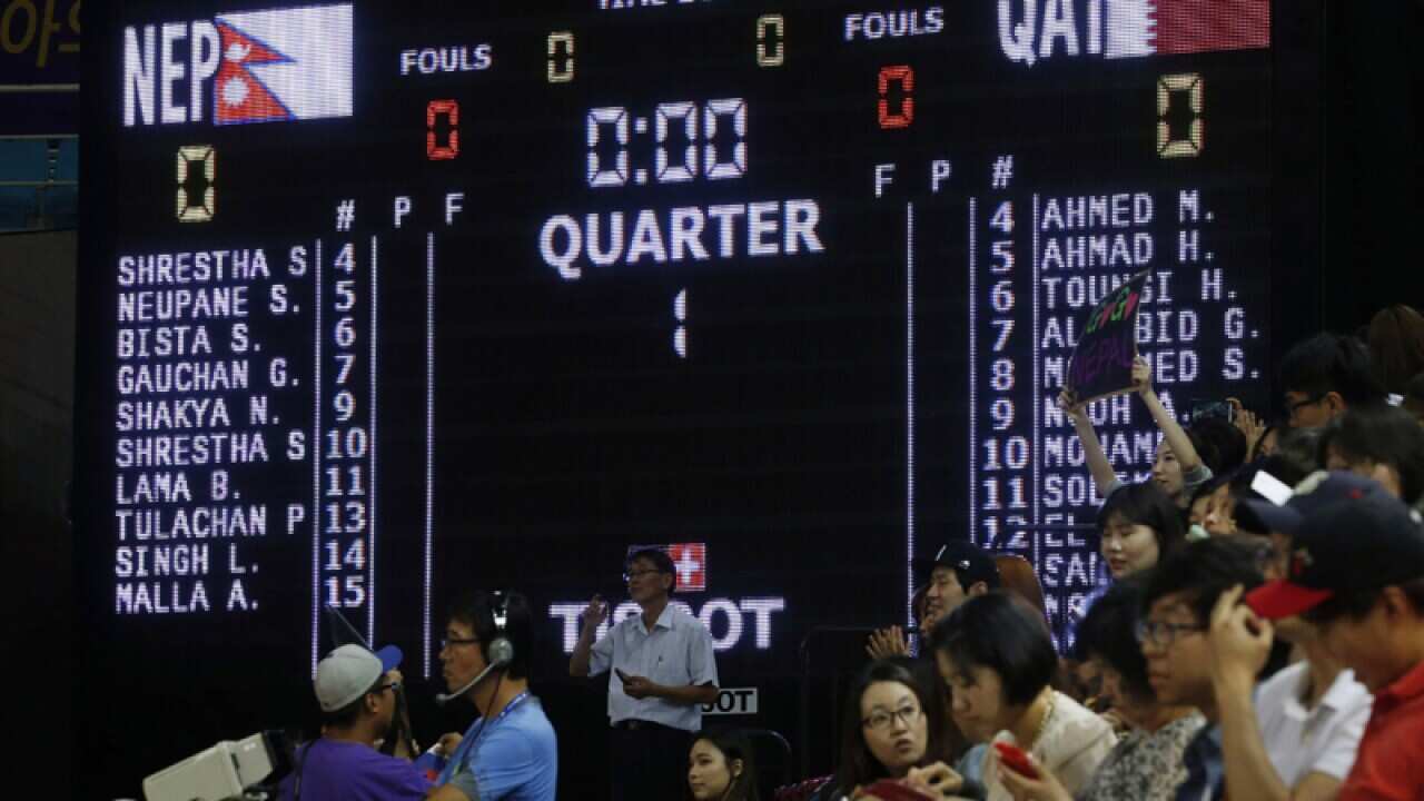 A scoreboard showing the start of the Nepal Qatar basketball game