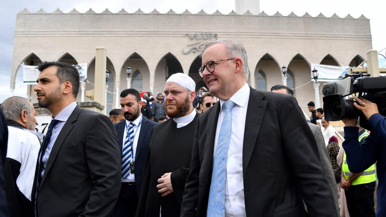 A group of men wearing suits seen outside a mosque in Sydney