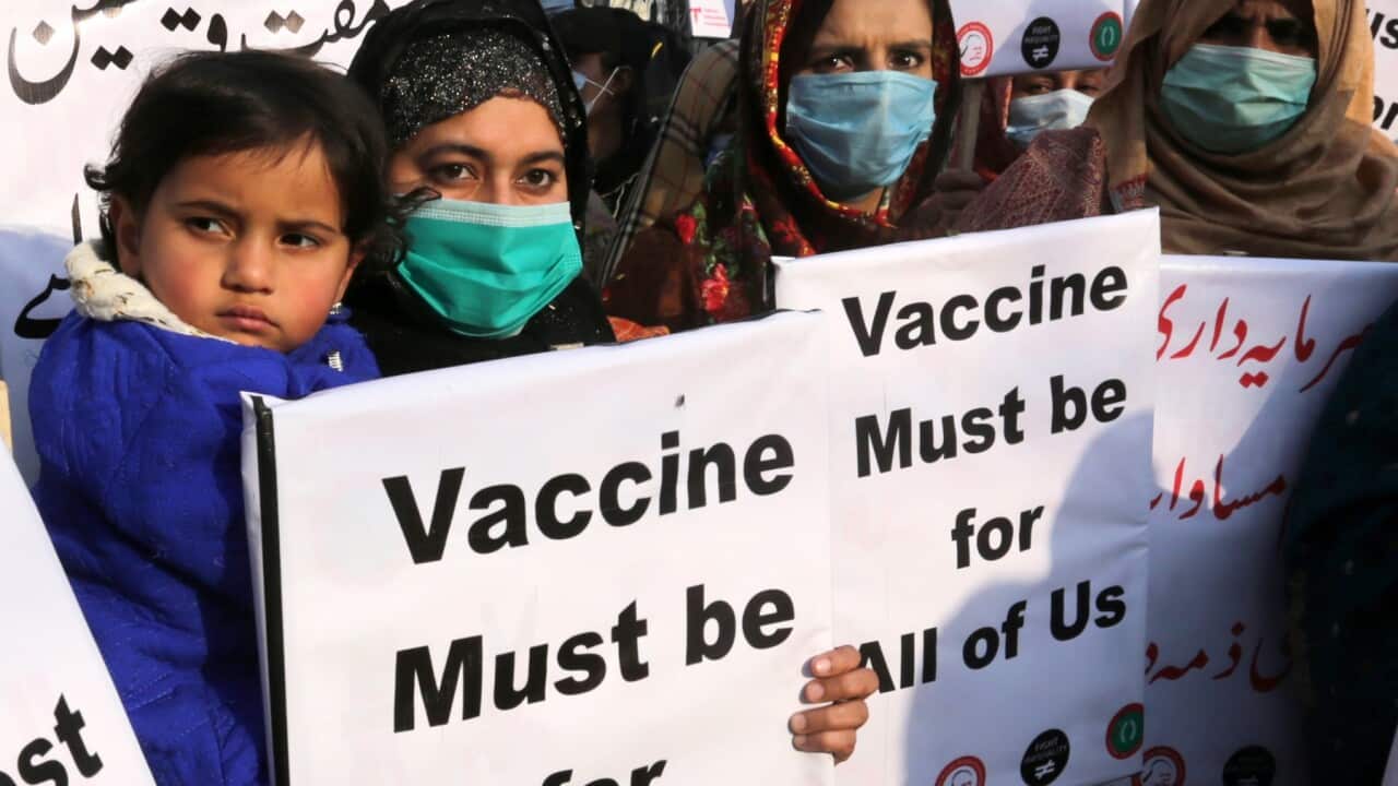 Women hold placards to demand fair distribution of vaccines to developing countries during a protest in Lahore, Pakistan, 29 January 2021.