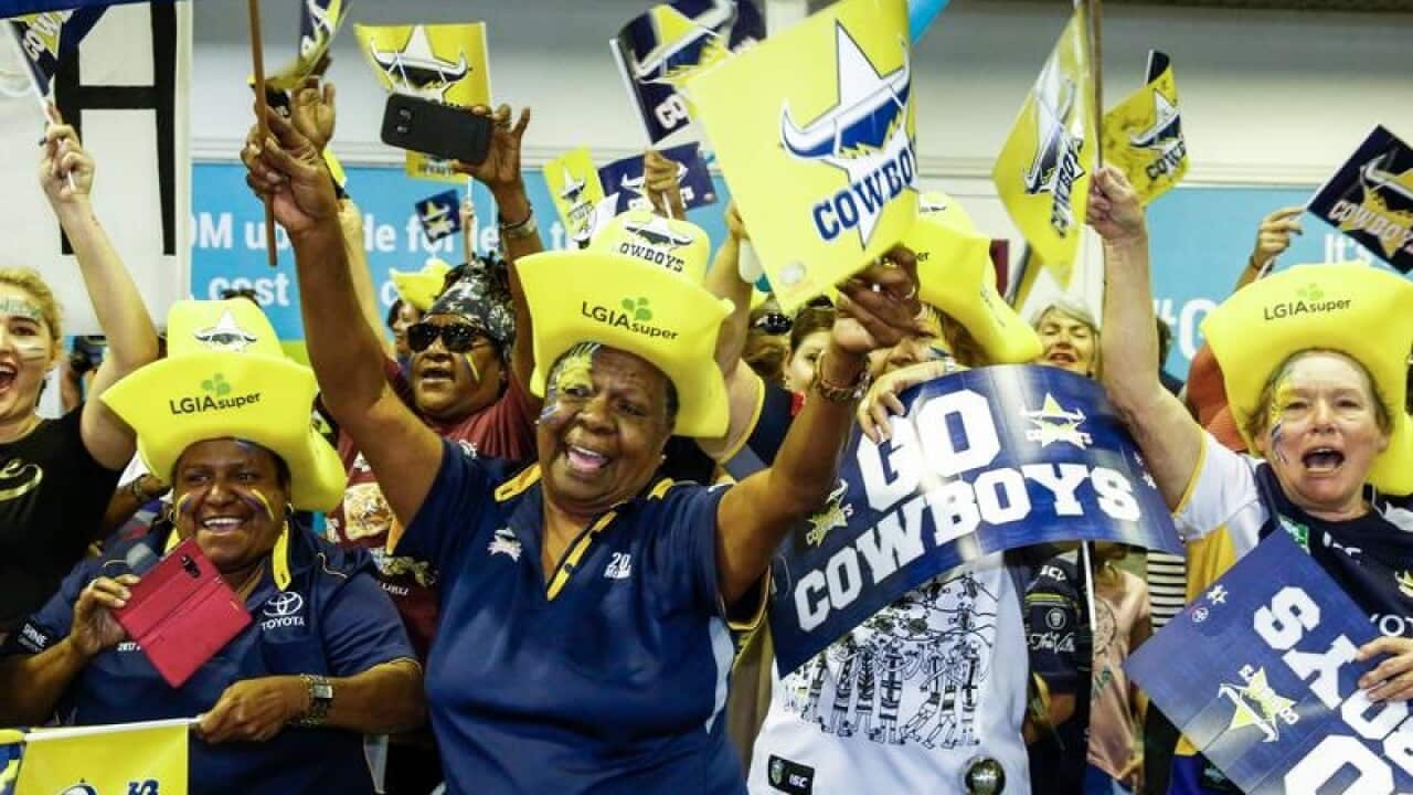 The NQ Cowboys are farewelled by fans at airport.
