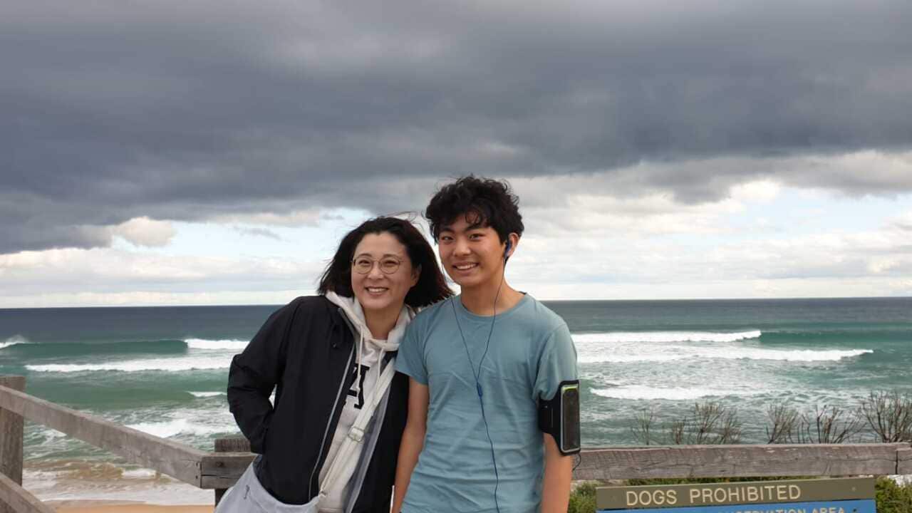 Dr Wonsun Shin Senior Lecturer in Media and Communications at the University of Melbourne is standing with her Year 12 son.