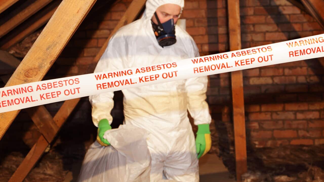 man removing asbestos