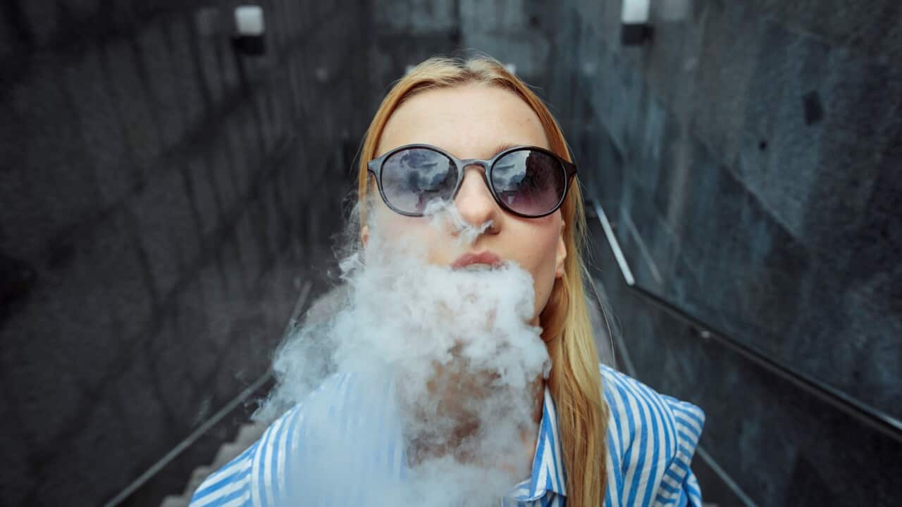 Girl smoking electronic cigarette