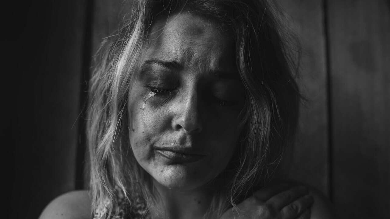 Image of a distressed woman by Unsplash