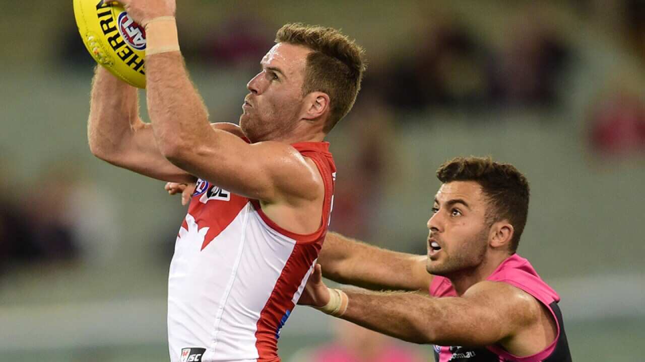Sydney Swans player Ben McGlynn (left) marks.