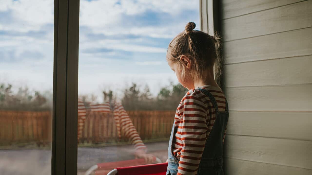 Girl looking out a Window