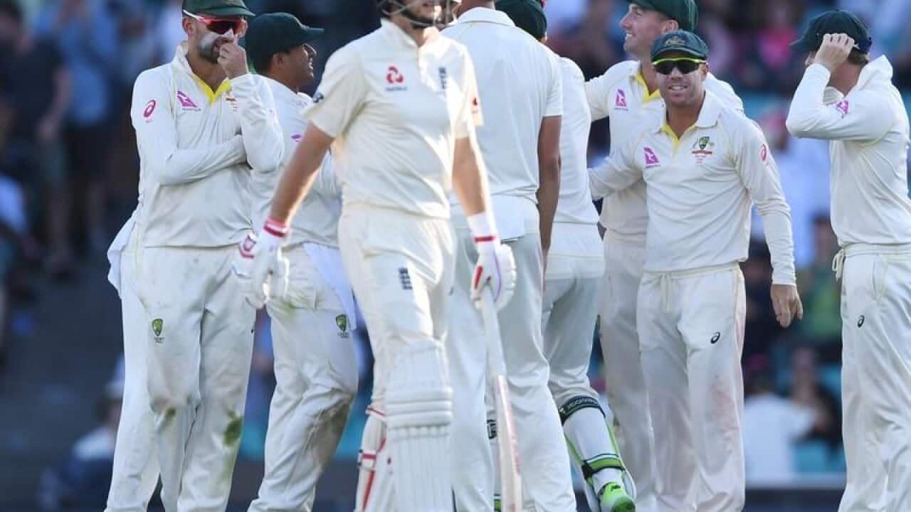 Australia celebrate the wicket of England captain Joe Root