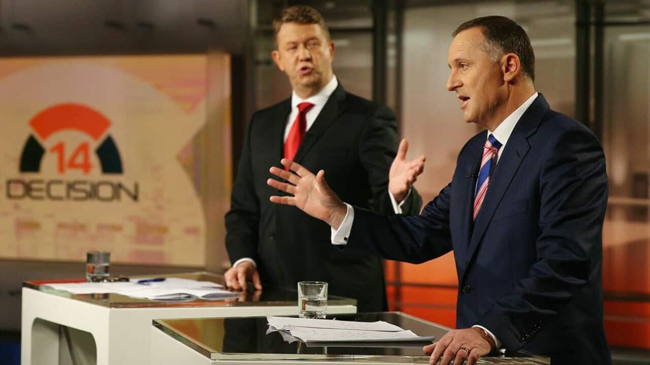 Labour leader David Cunliffe (left) and New Zealand Prime Minister John Key discuss the issues at TV3's political debate. (AAP/Mediaworks)