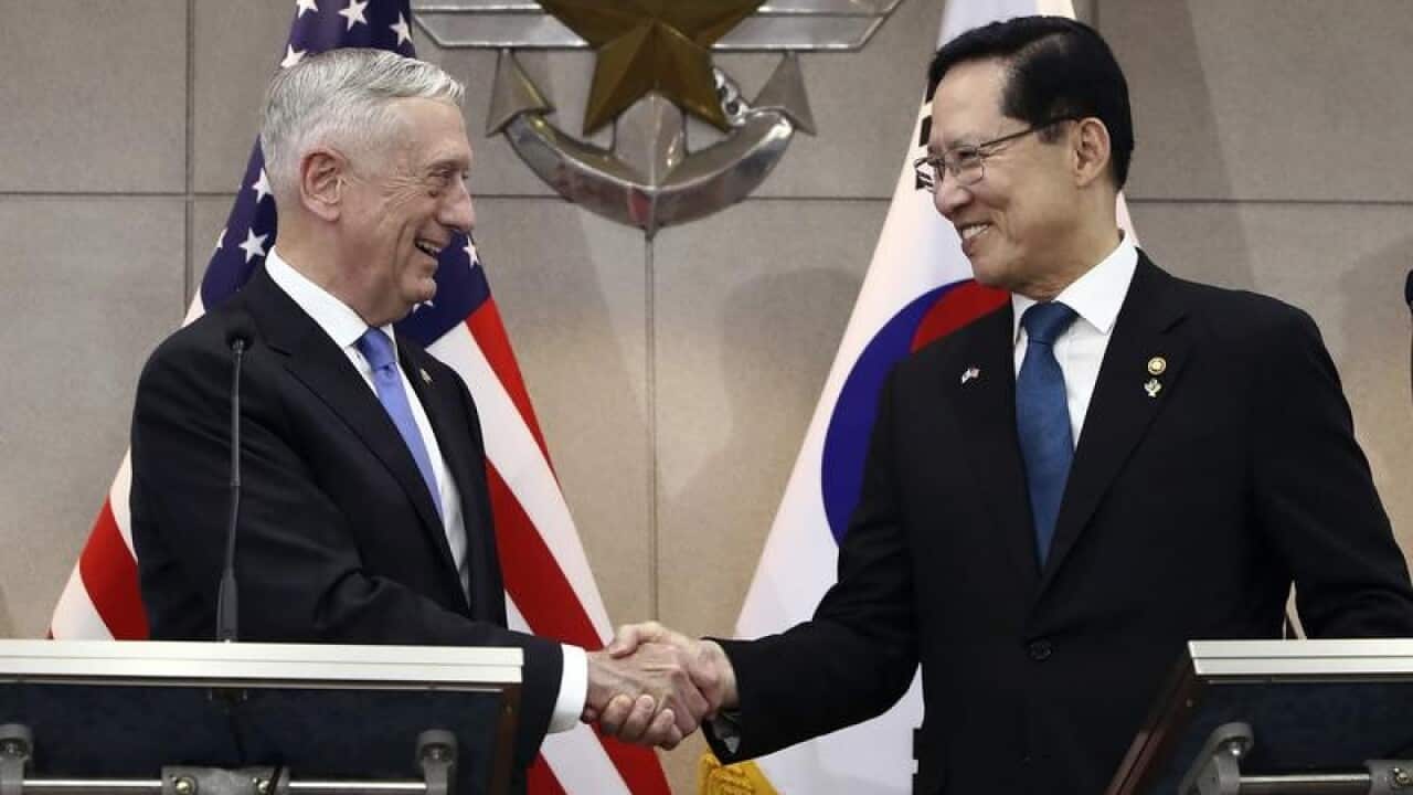 Jim Mattis shakes with South Korean Defence Minister Song Young-moo