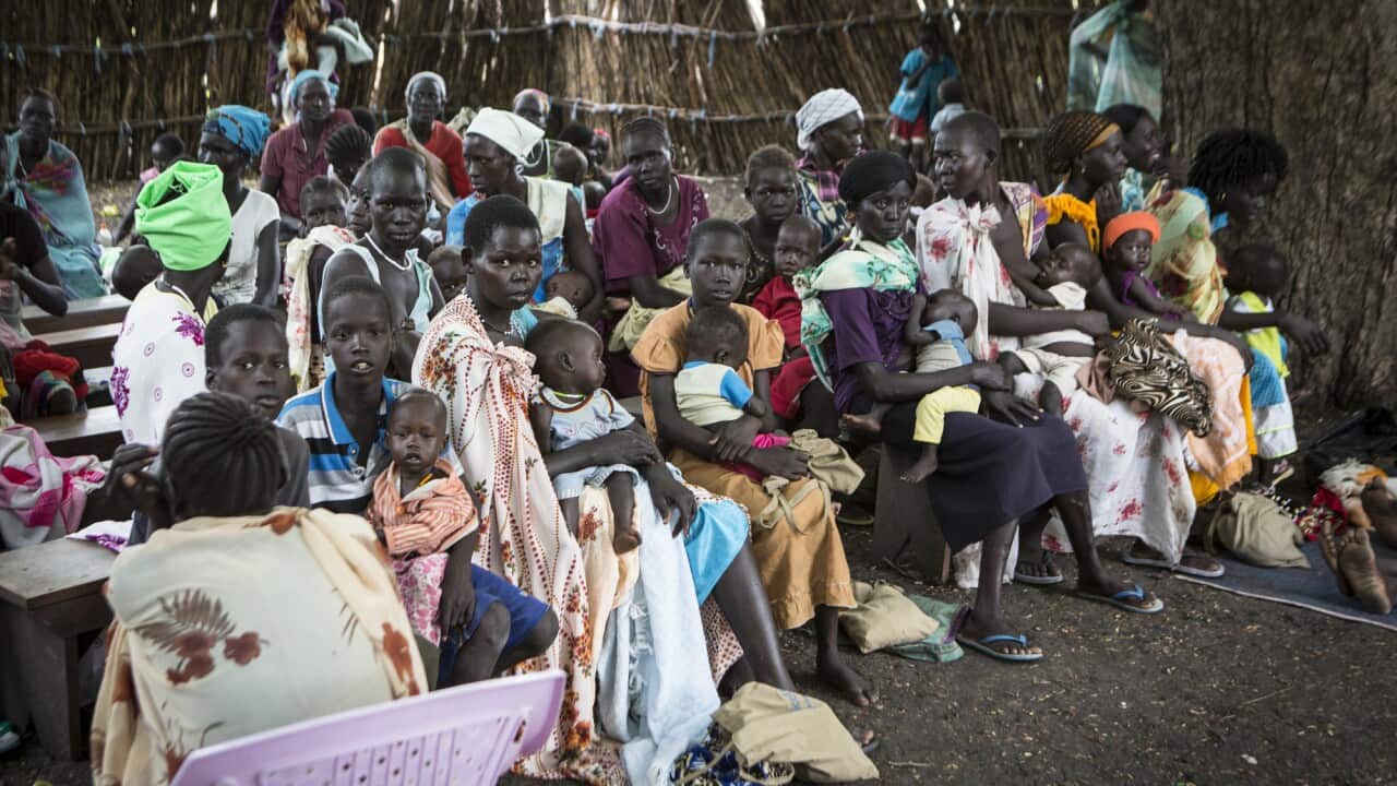 A group of mothers and children at Save the Children’s outpatient therapeutic feeding clinic, where they have been treated for malnutrition, Akobo, South Sudan. (Save the Children)