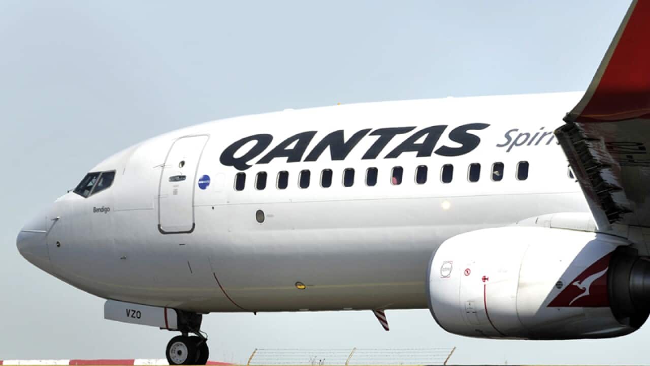 A Qantas plane taxis at Sydney airport