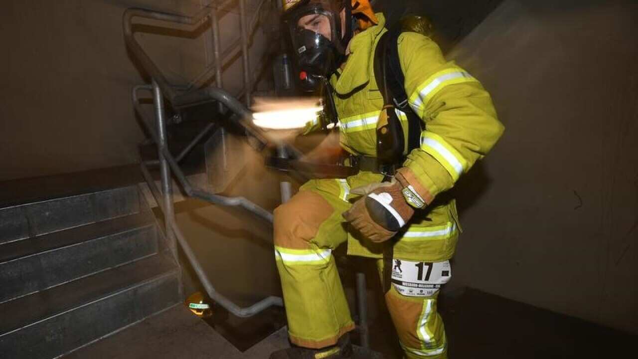 Firefighter wearing breathing equipment.