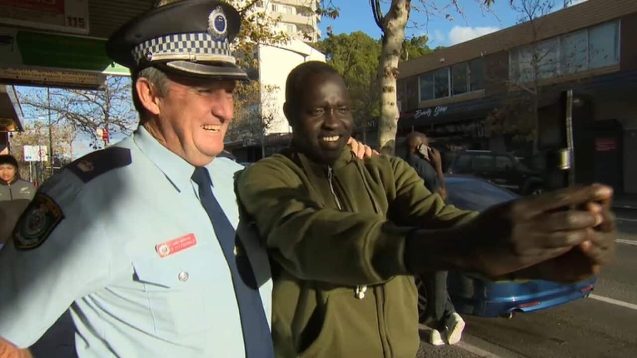 Chief inspector Bob Fitzgerald poses for a selfie with a resident