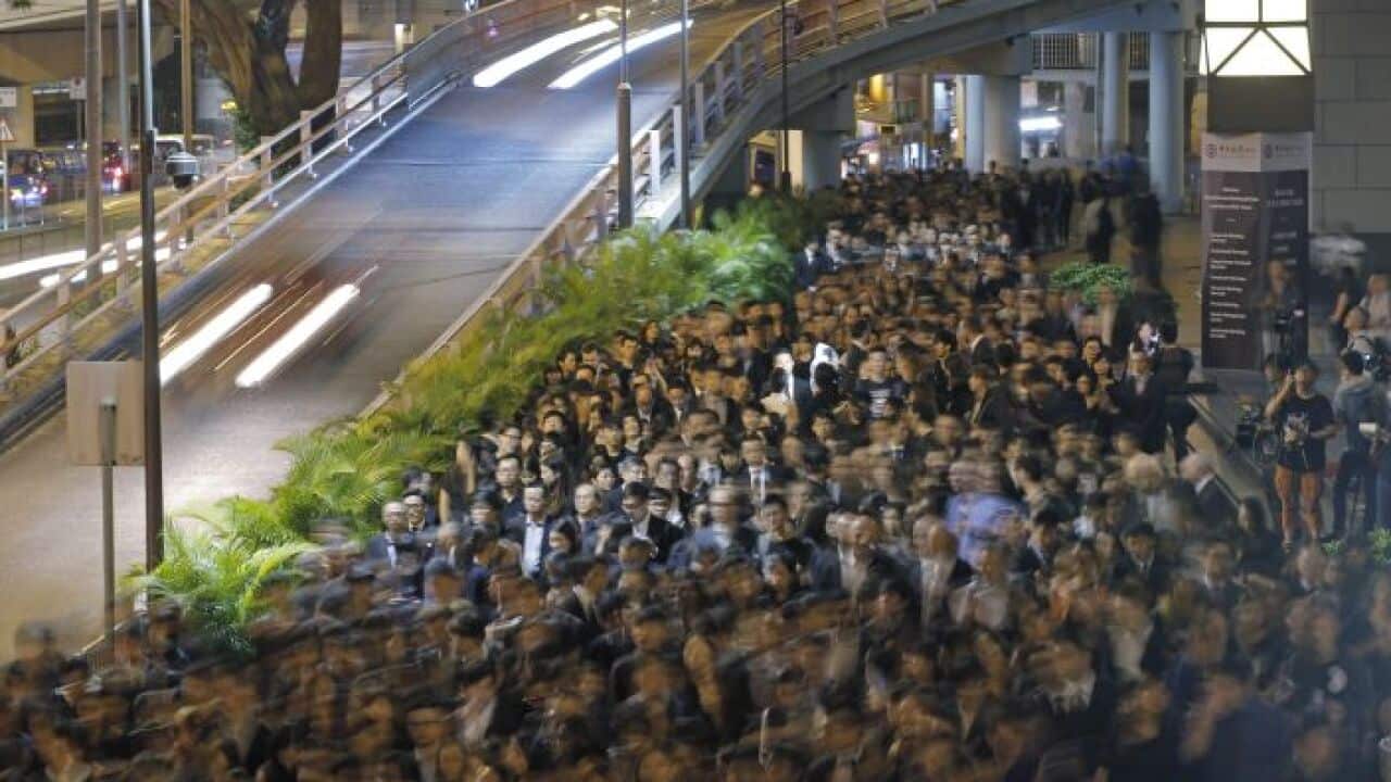 Hong Kong lawyers take part in a silent protest march through downtown streets in Hong Kong