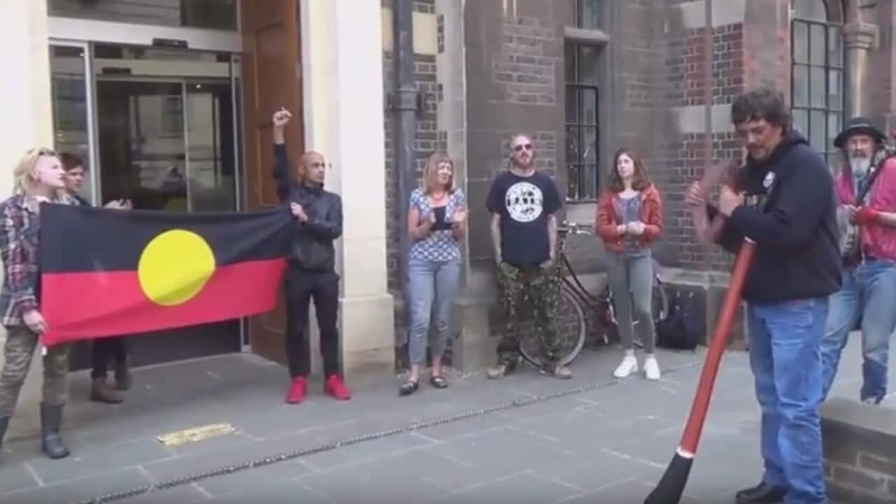 Protesters outside the Cambridge University, led by Rodney Kelly (right)