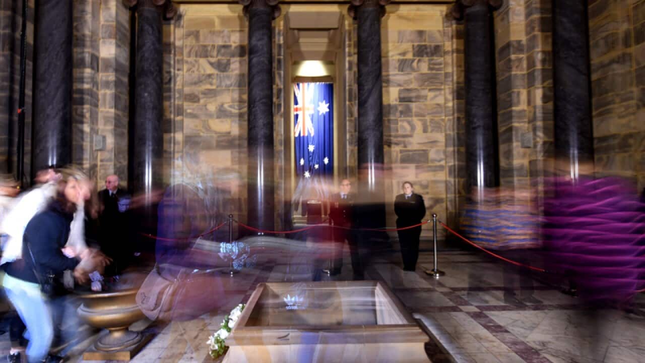 Visitors lay poppies at the Shrine of Remembrance in Melbourne
