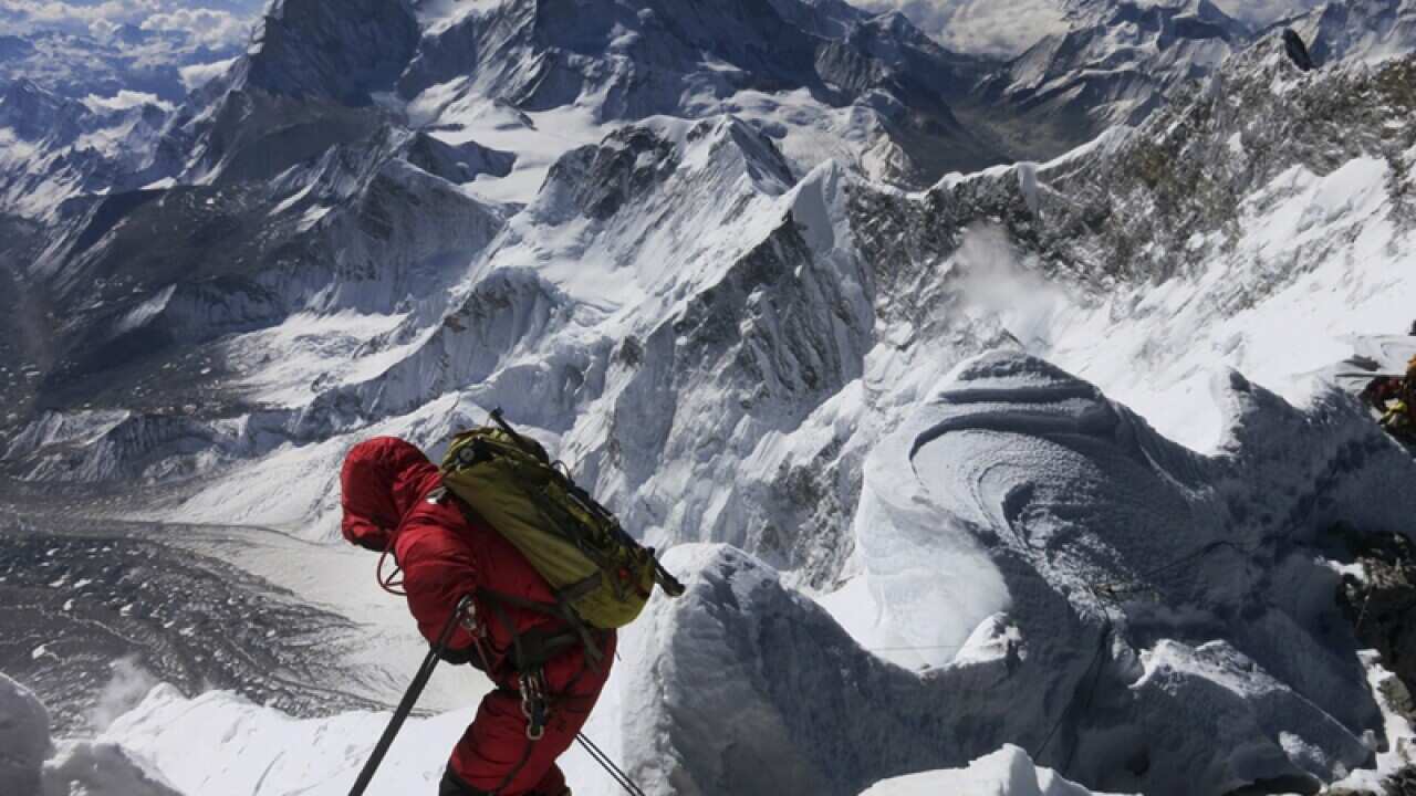 a climber as he makes his way down from the summit of Mount Everest.