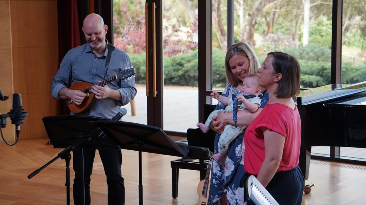 Samantha Jackson and her child, Benjamin, singing their lullaby
