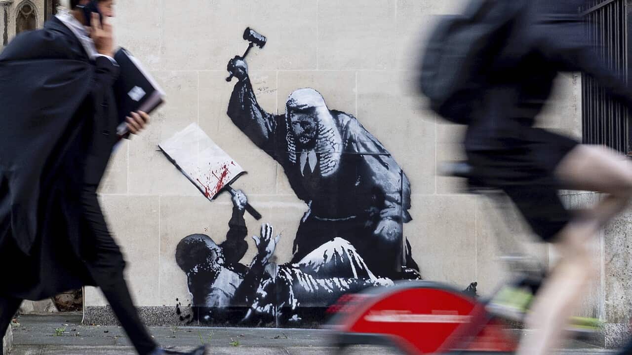 Banksy Mural at Royal Courts of Justice is quickly covered after appeared at night Banksy Mural at Royal Courts of Justice is quickly covered after appeared at night