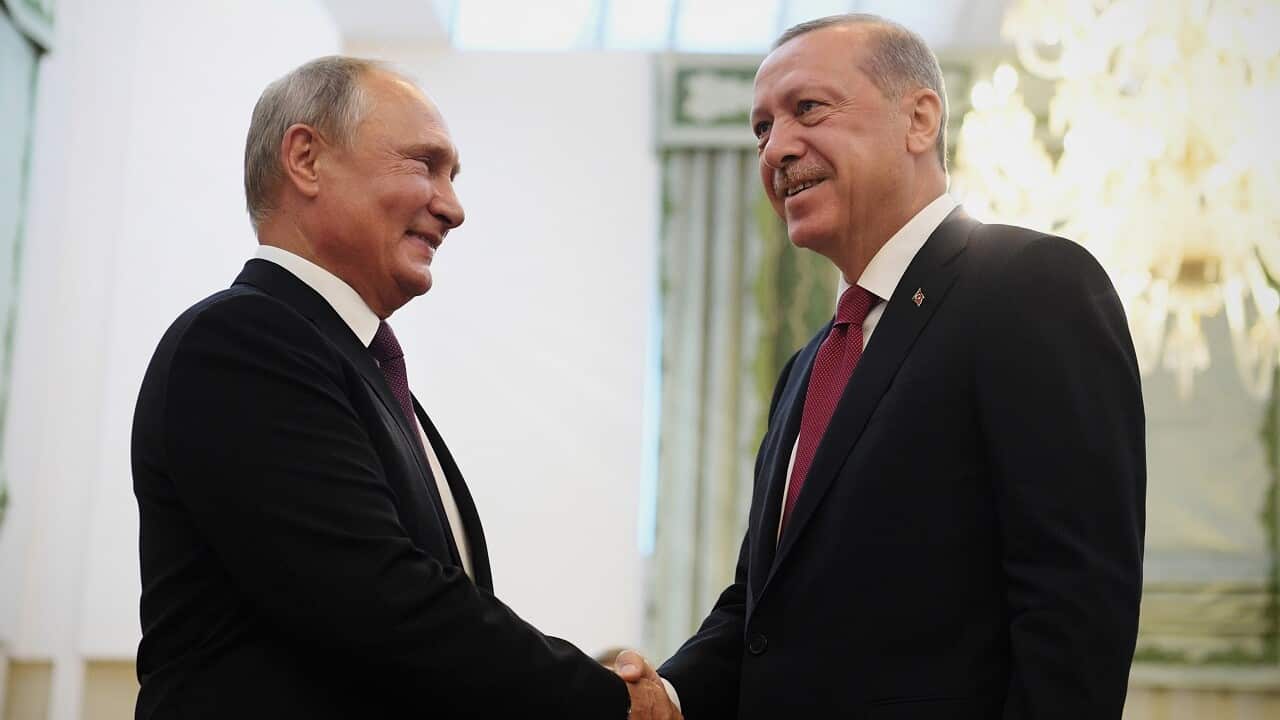Russian President Vladimir Putin shakes hands with his Turkey's counterpart Recep Tayyip Erdogan on Friday.