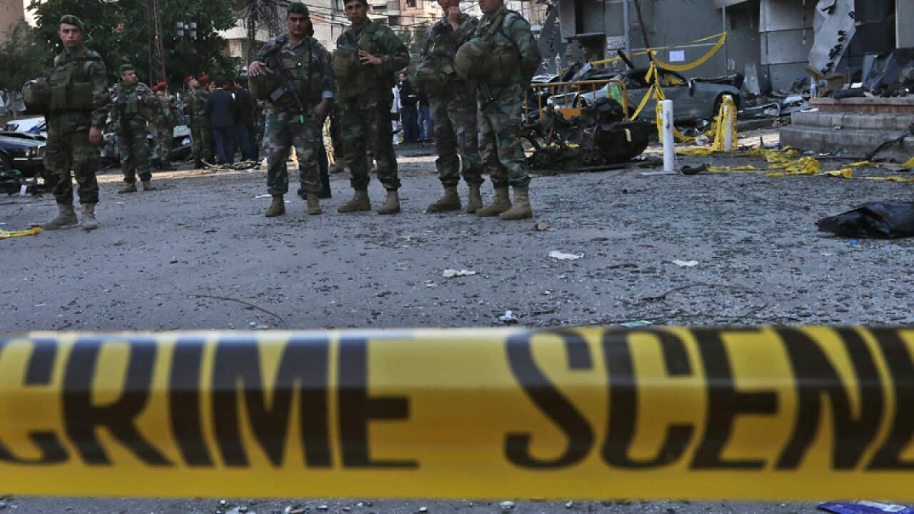 Lebanese soldiers stand guard at the site of an explosion in Beirut